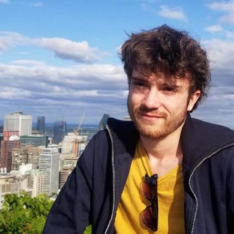Portrait of Timothé Boulet outdoors, a city skyline behind him.